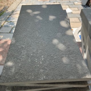 Dark grey basalt flamed surface 